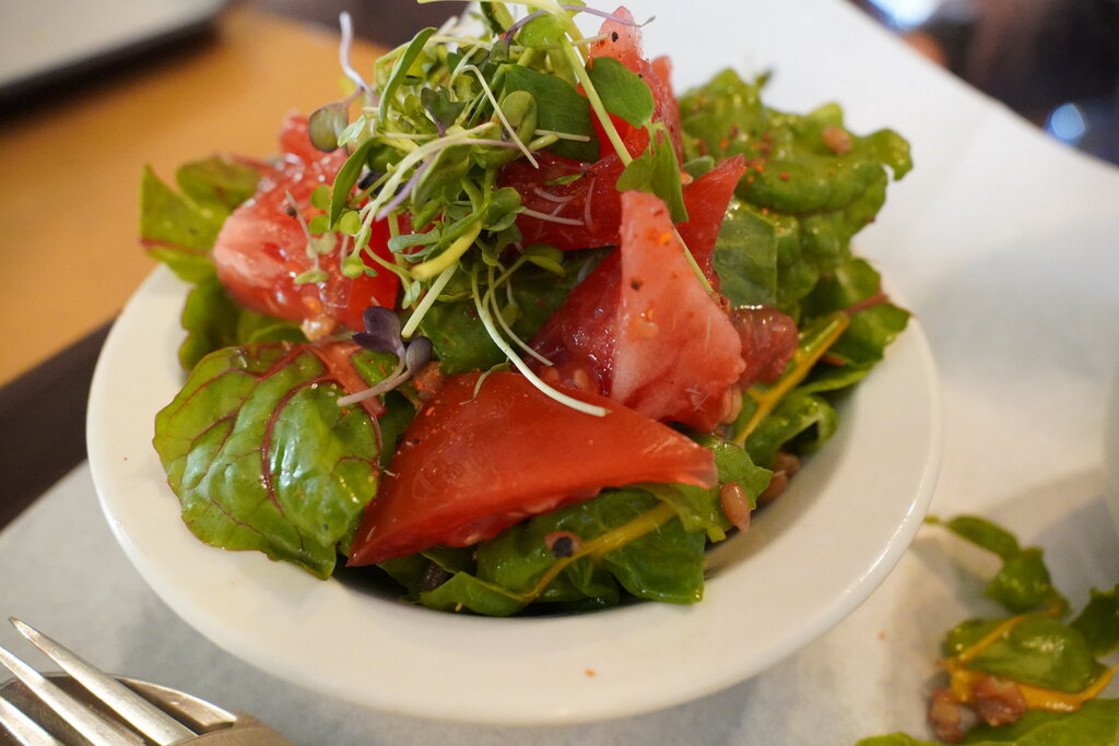 House salad with tomatoes, microgreens, and chard